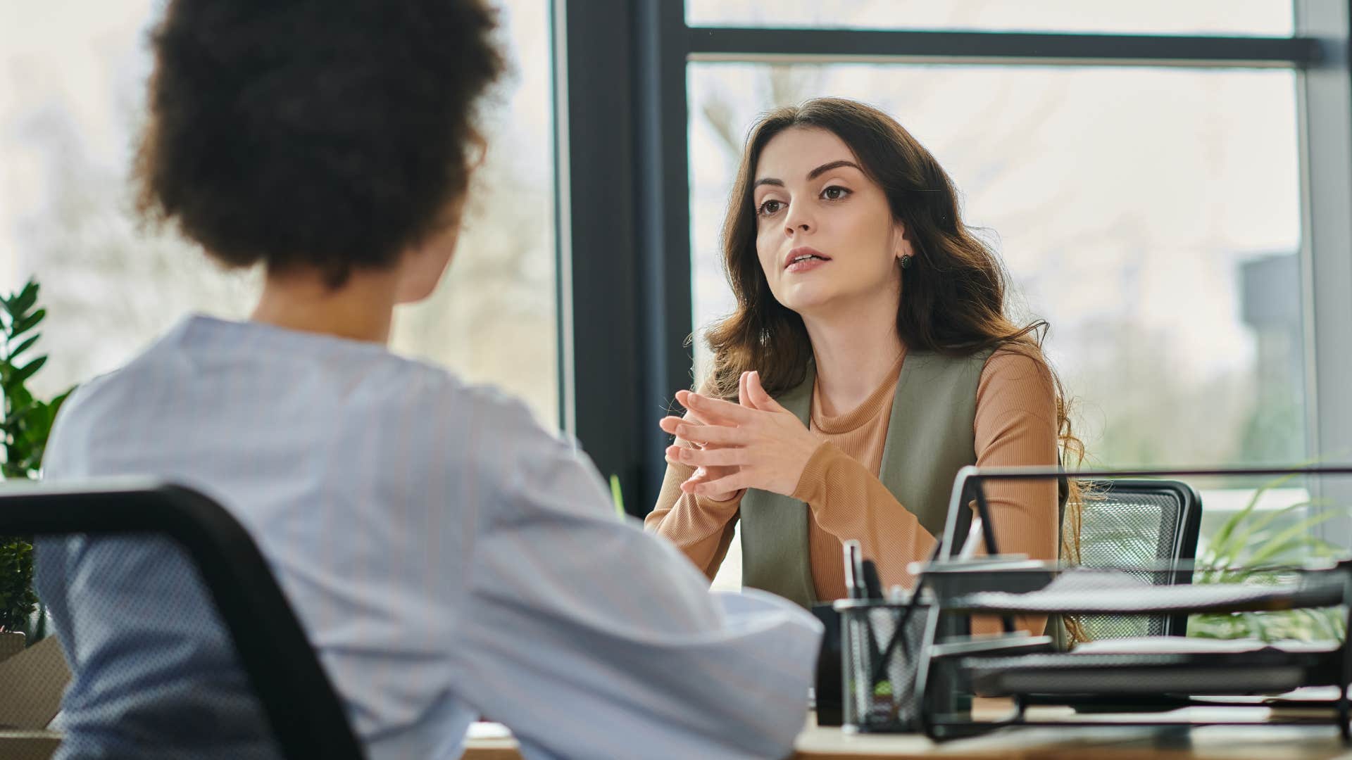 woman giving colleague backhanded compliment
