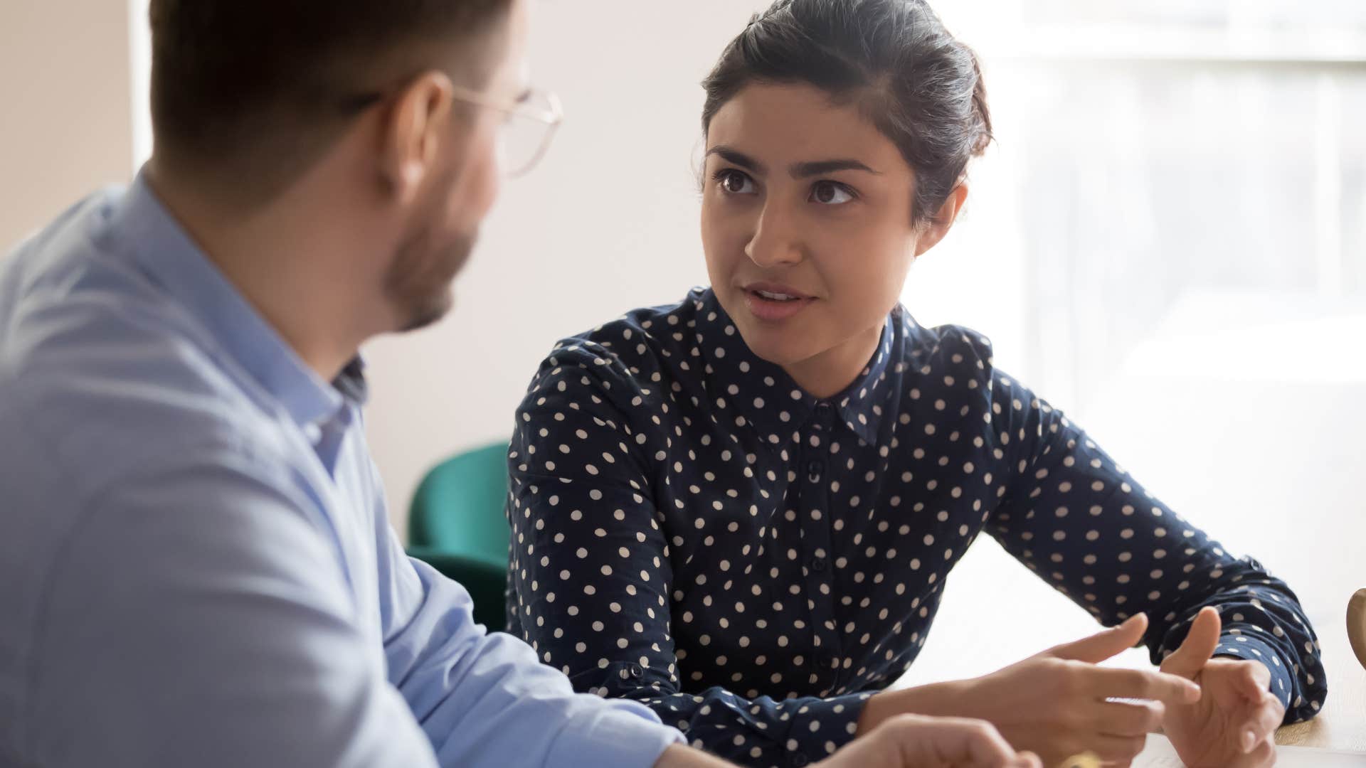 woman talking about her salary looking at a co-worker