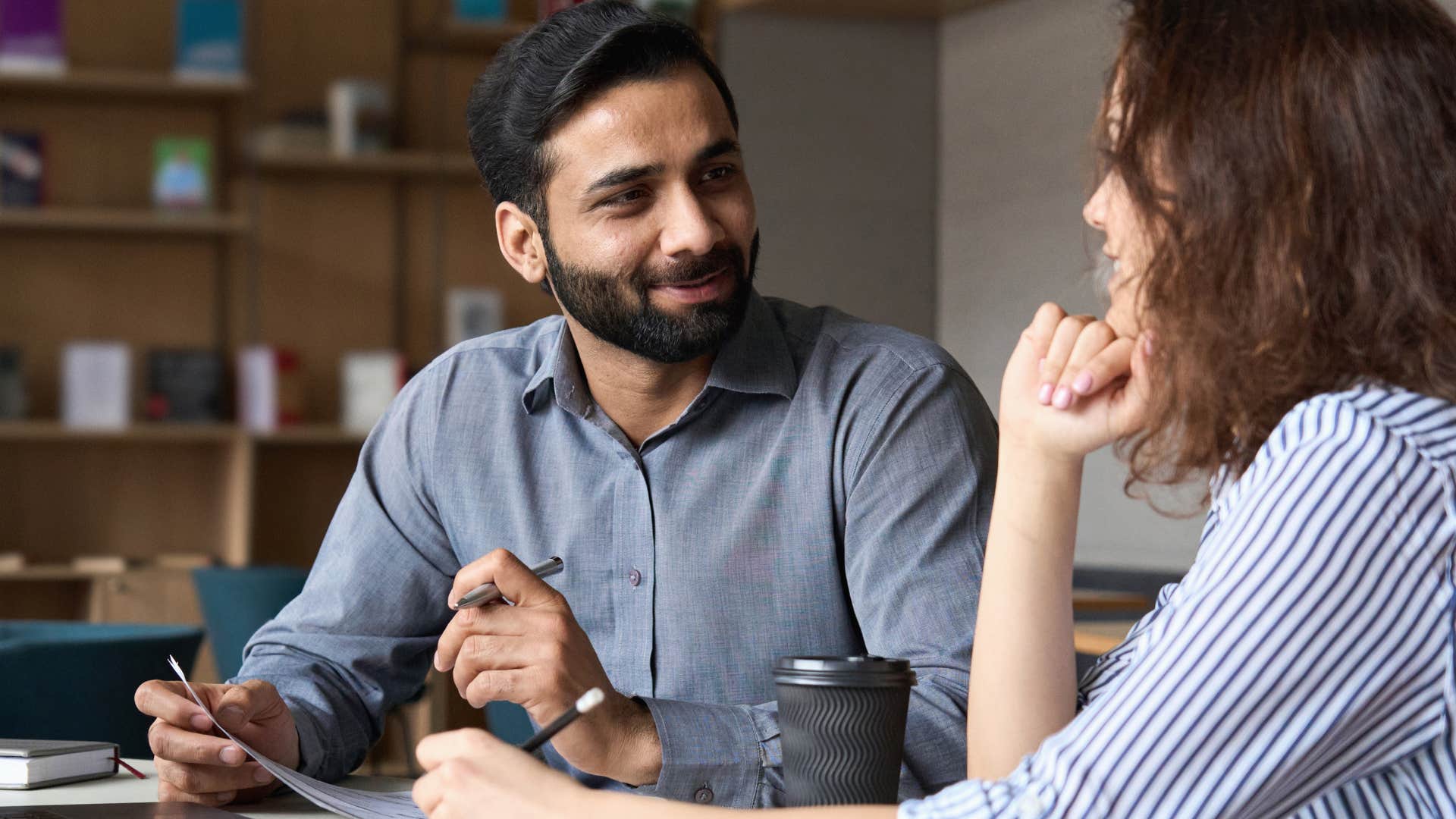arrogant man using overcomplicated words with a work peer