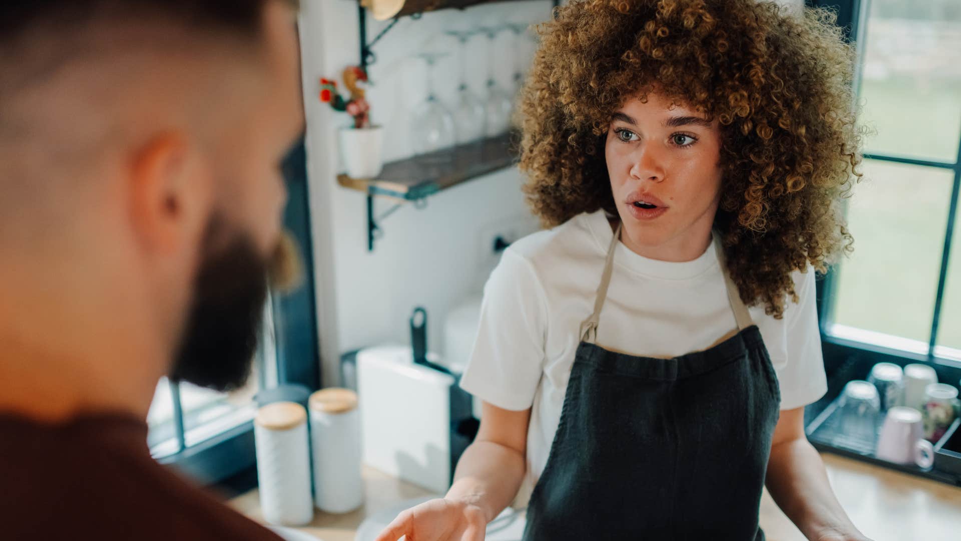upset woman talking to customer who lacks basic manners