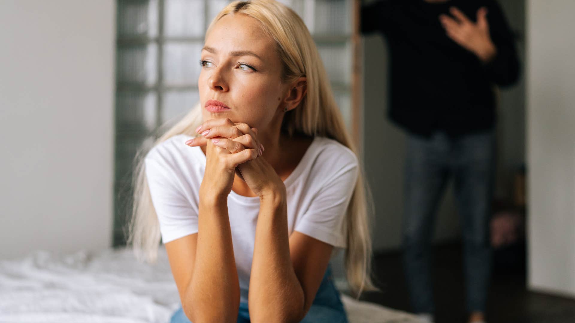 woman avoiding vulnerability turned away from partner