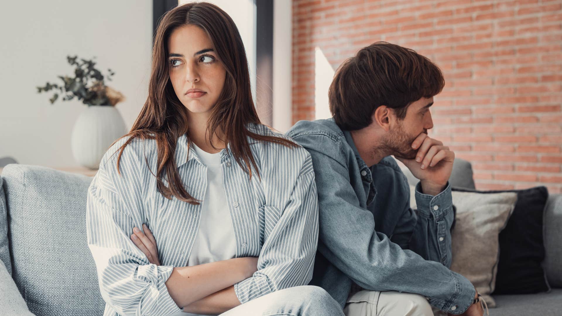 overly competitive couple turned away from each other