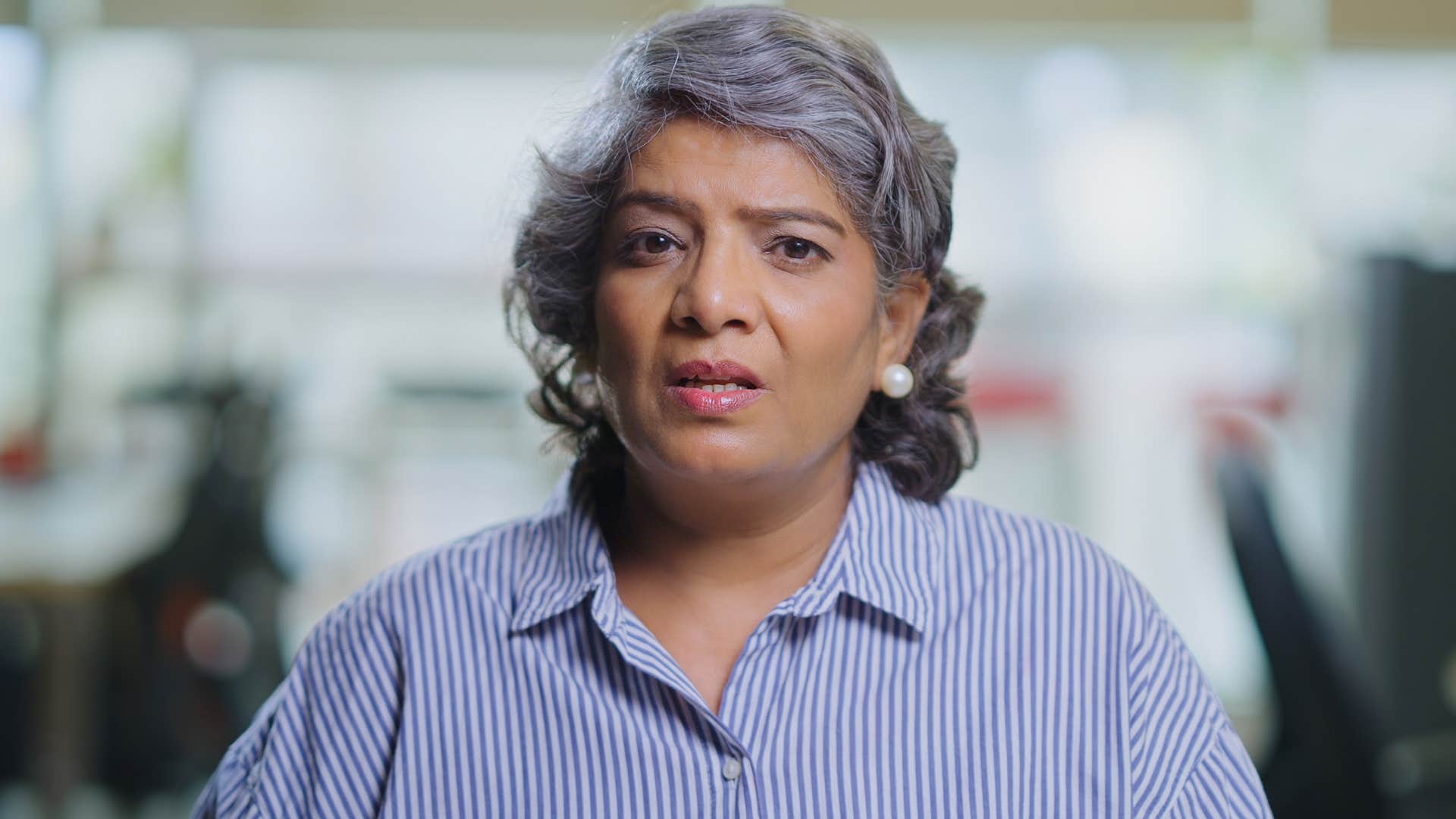 upset woman making passive-aggressive comments at work