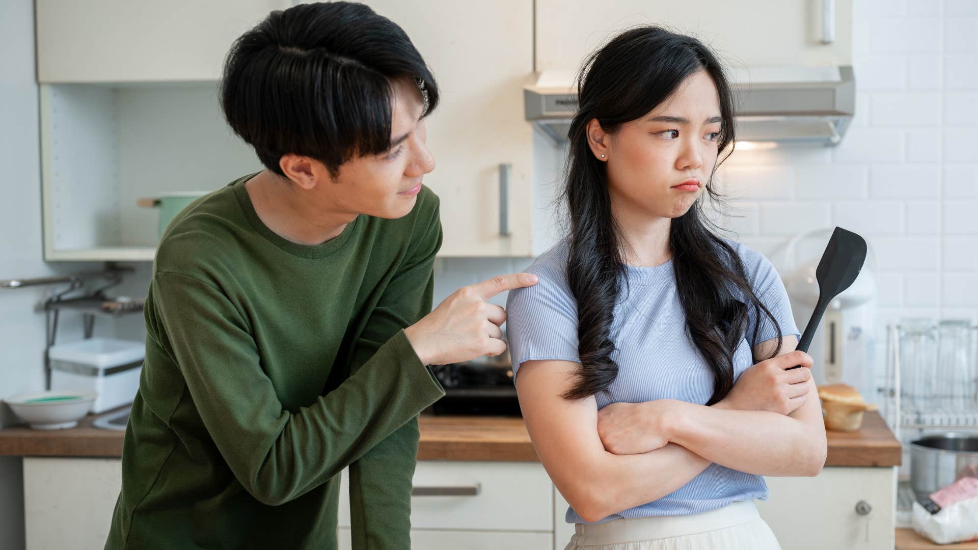 emotionally intelligent woman standing next to partner who cant be alone