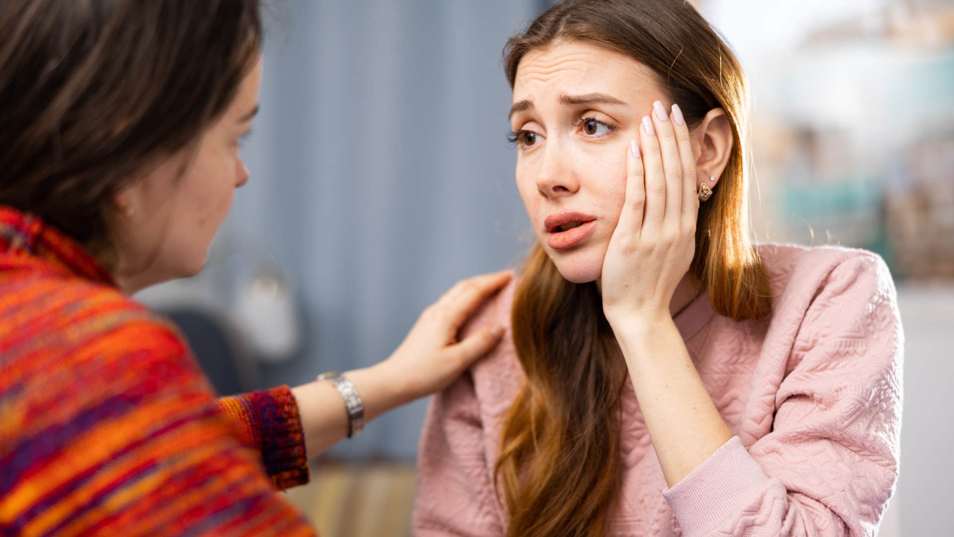 sad woman trauma dumping on her emotionally intelligent friend
