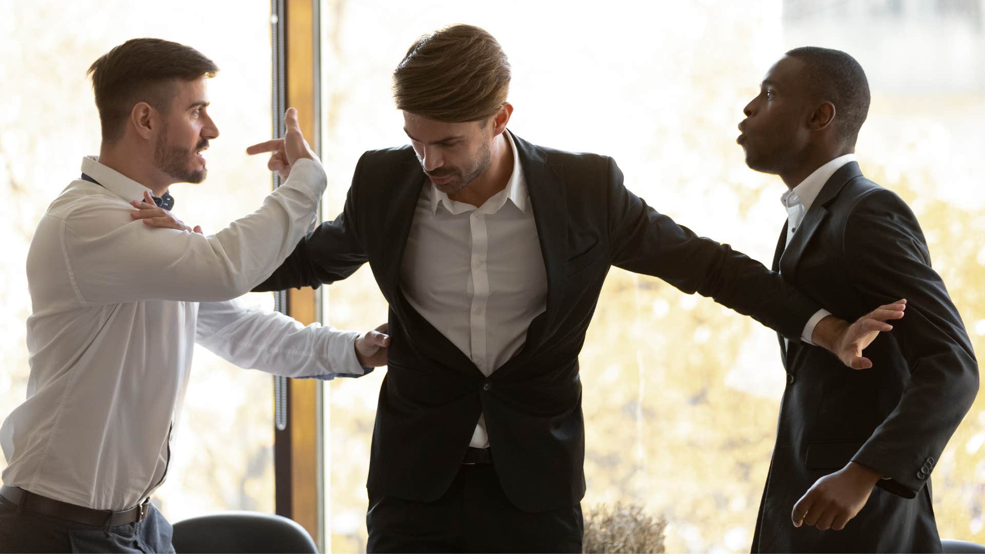 worker arguing with colleague who took credit for his idea