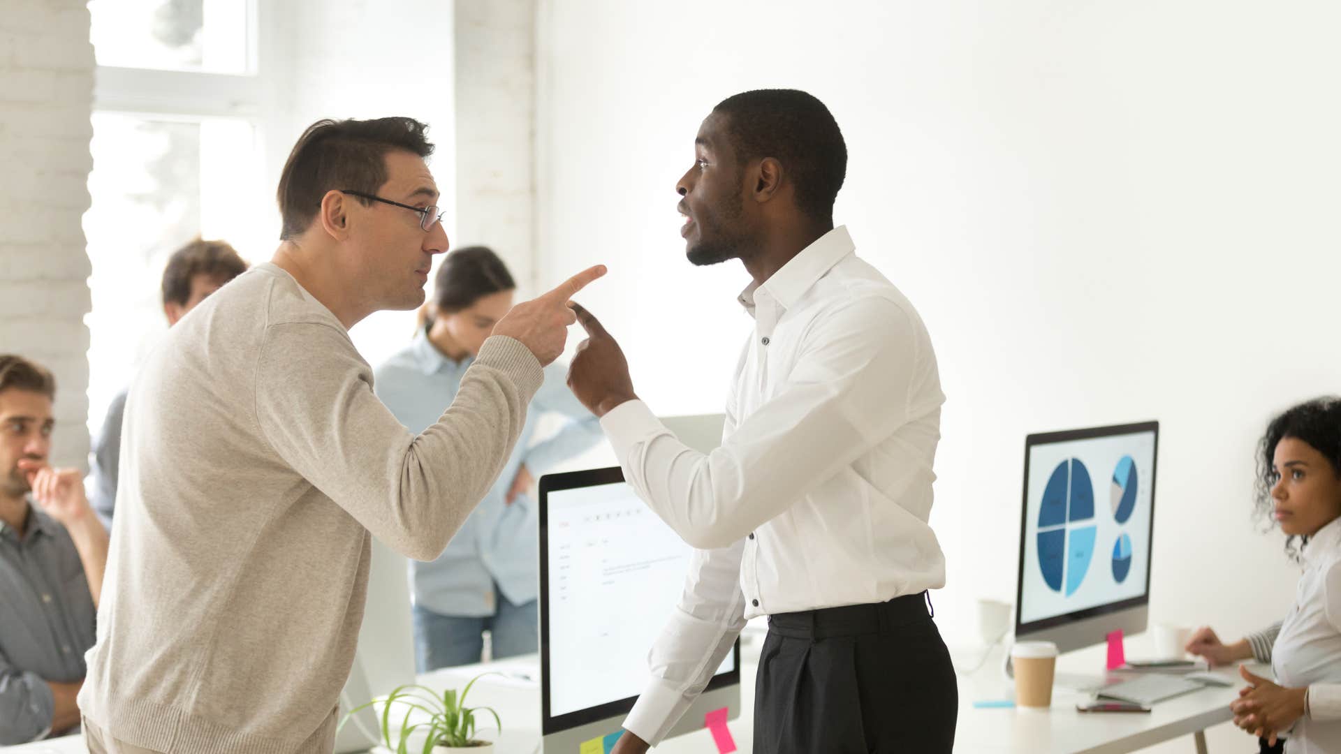 two colleagues having an emotional outburst at work