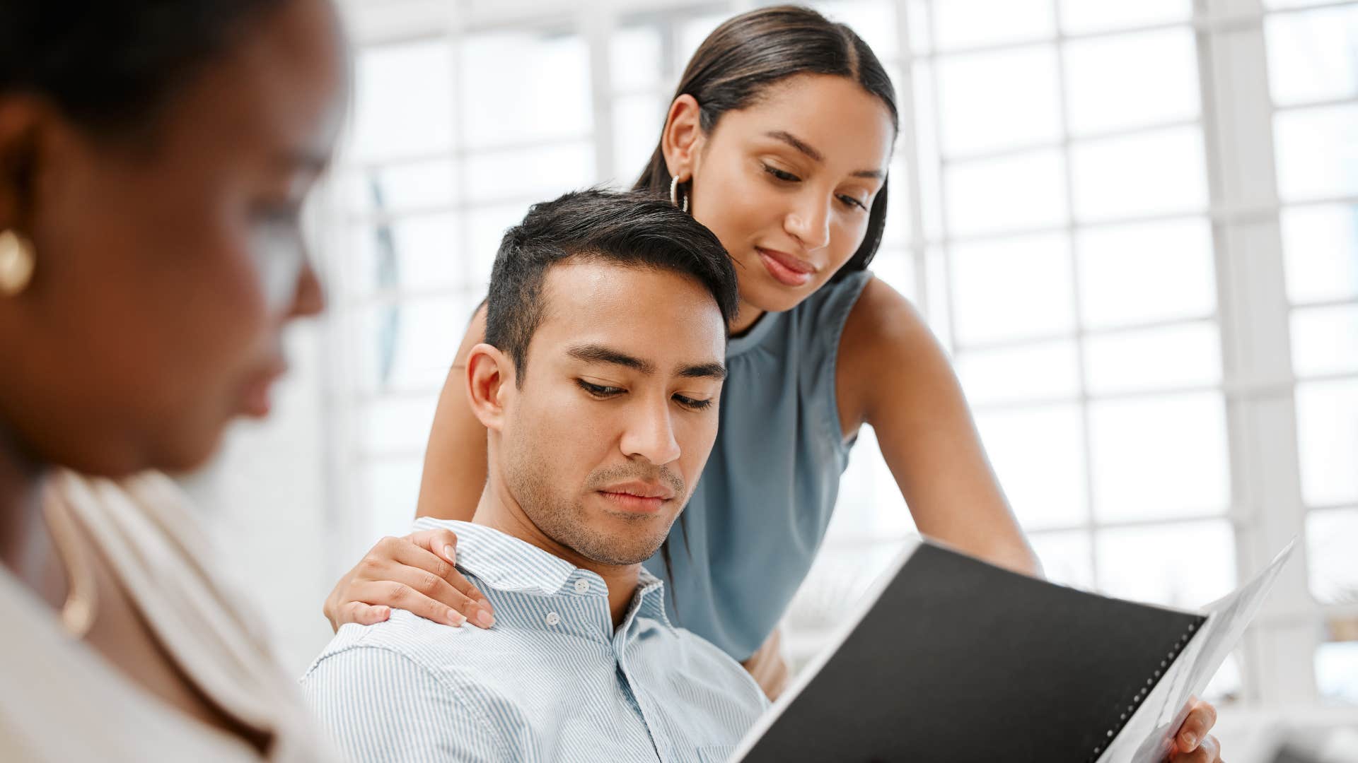 woman trying to flatter colleague at work