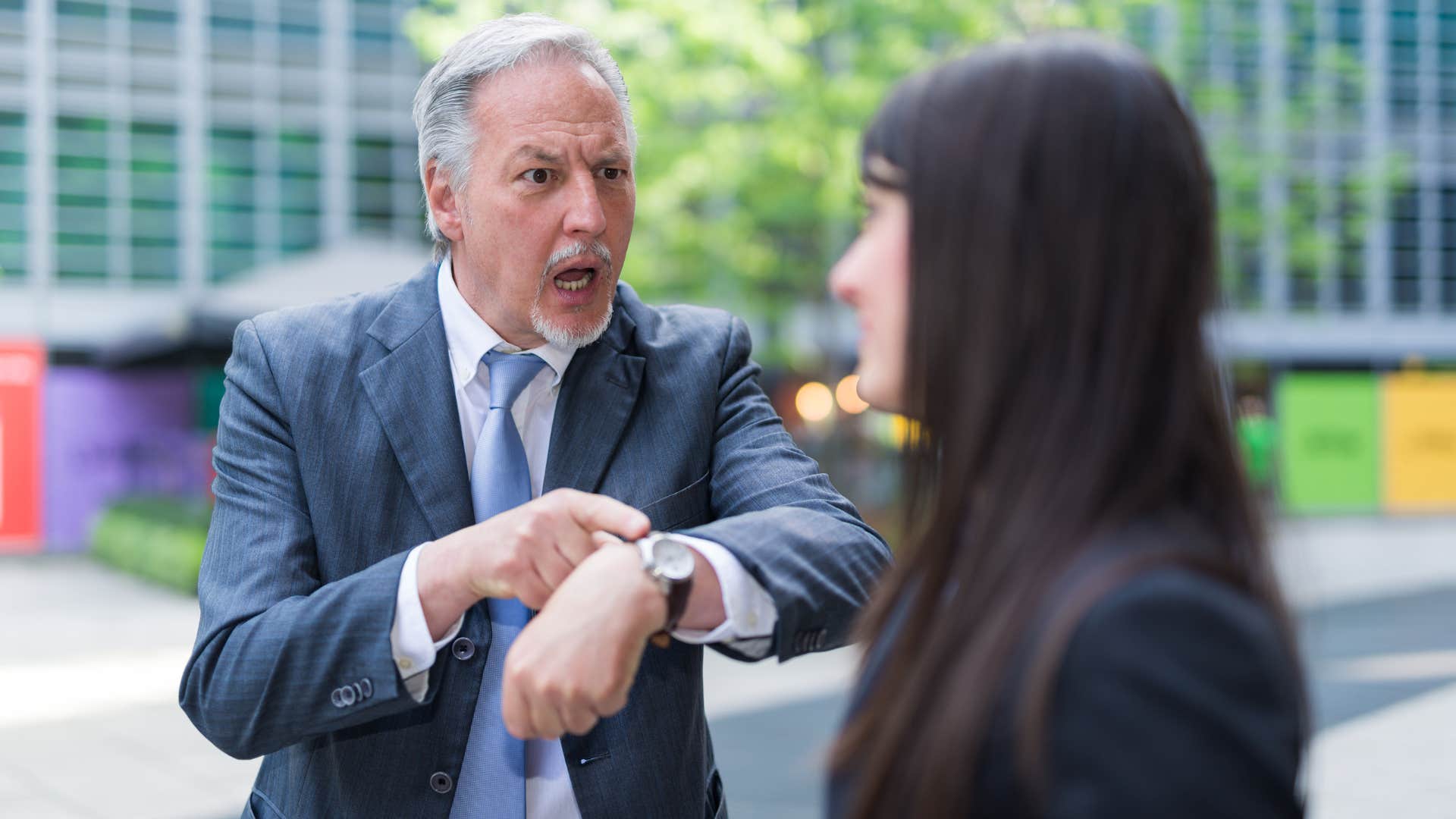 boss micromanaging his employee yelling at her