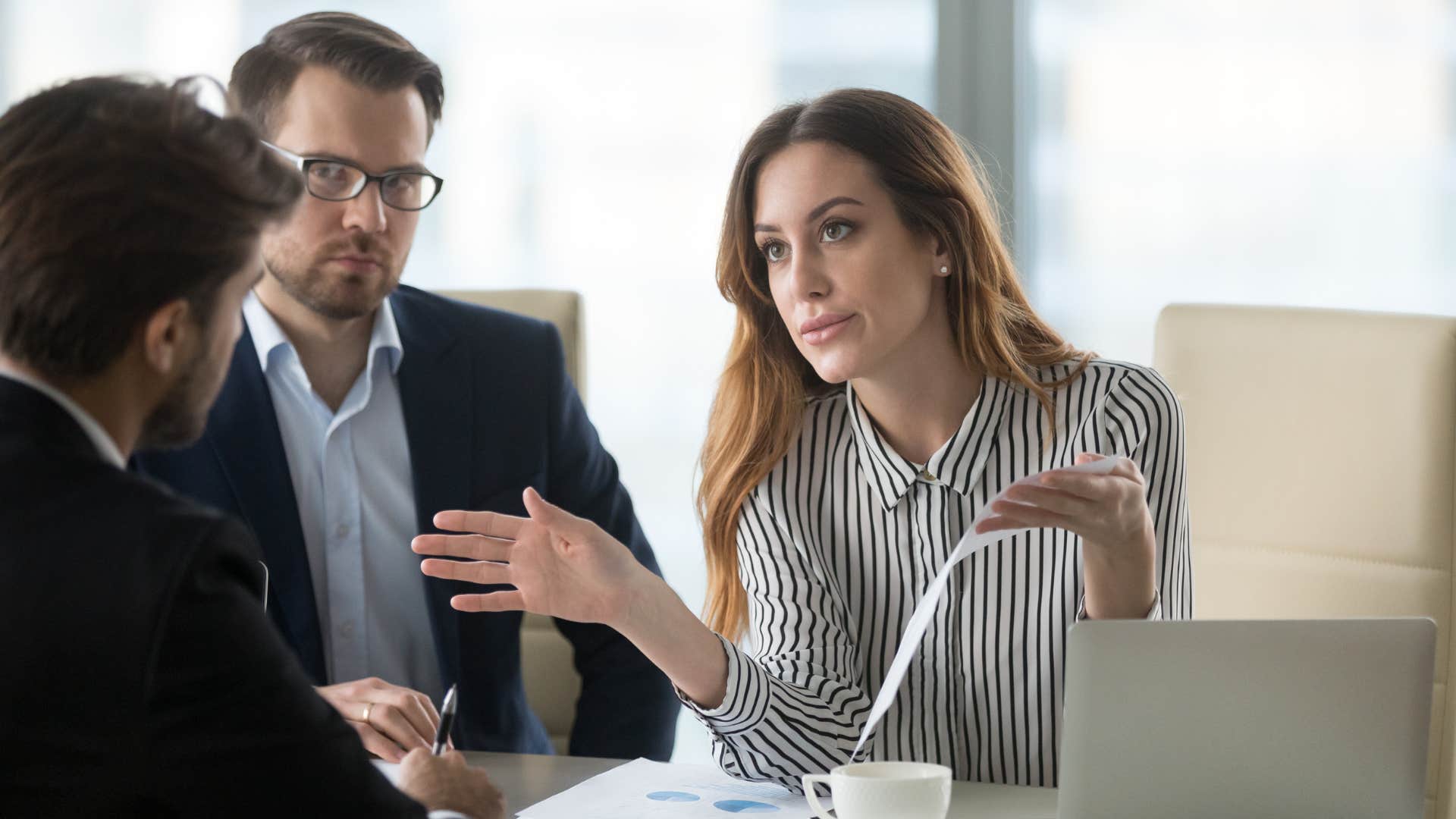professional woman dealing with office politics with colleagues