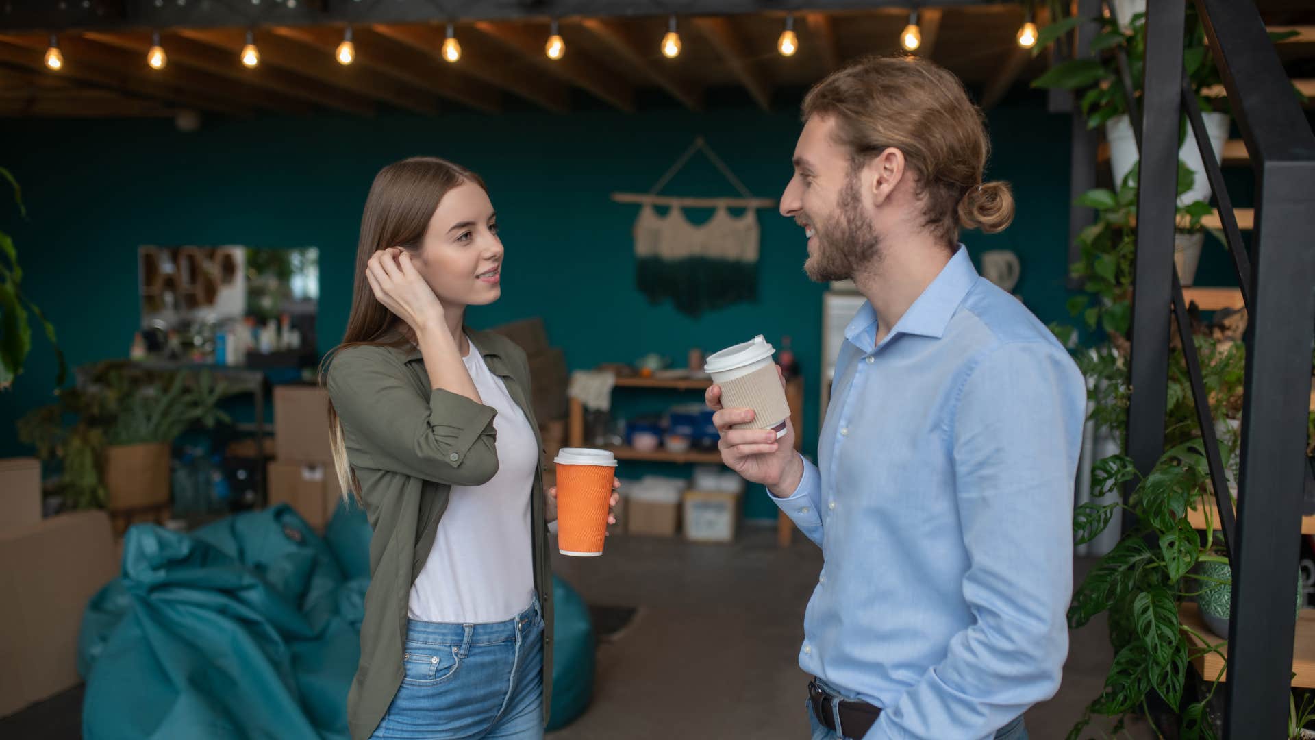 two people engaging in small talk at a coffee shop
