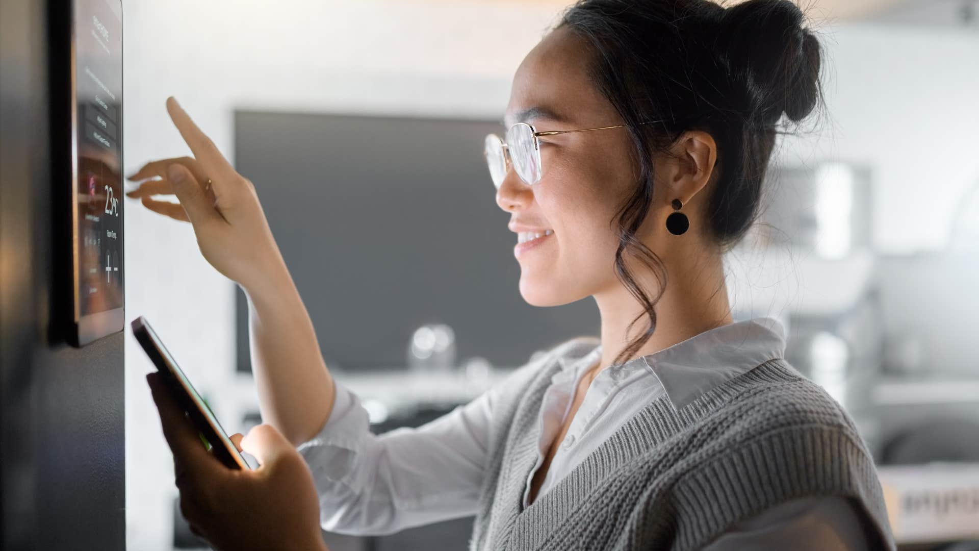 woman using many screens at once in her home
