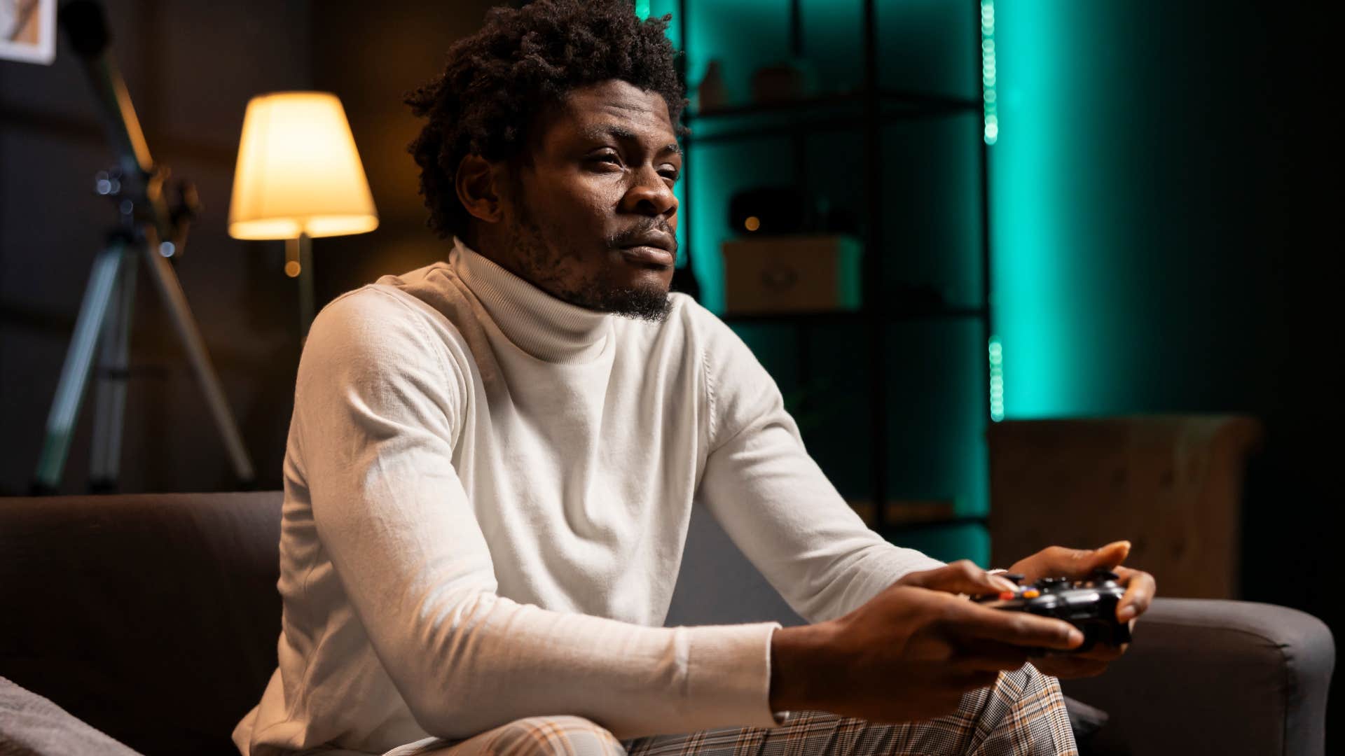 man watching movies from his home theater playing video games