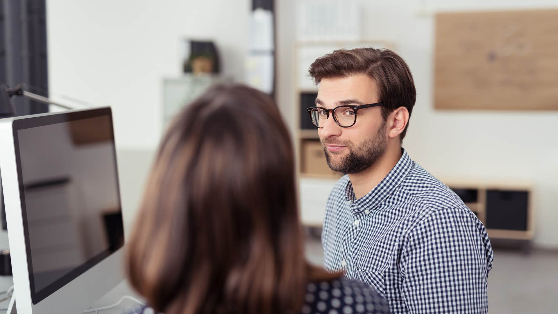 a man notices the passive aggressive digs that his female colleague says to him