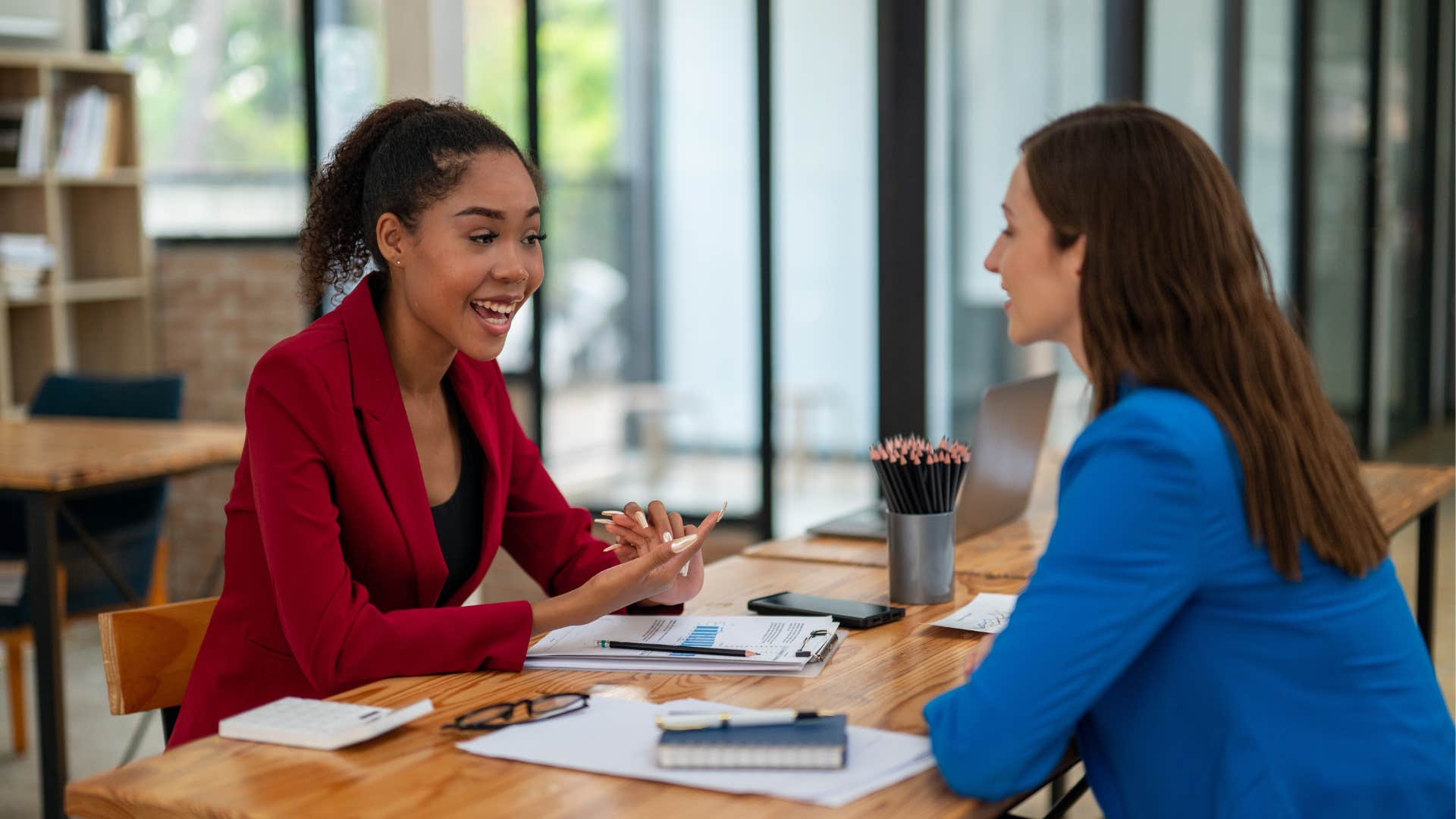 a worker talks to her boss about the unrealistic deadlines for the job