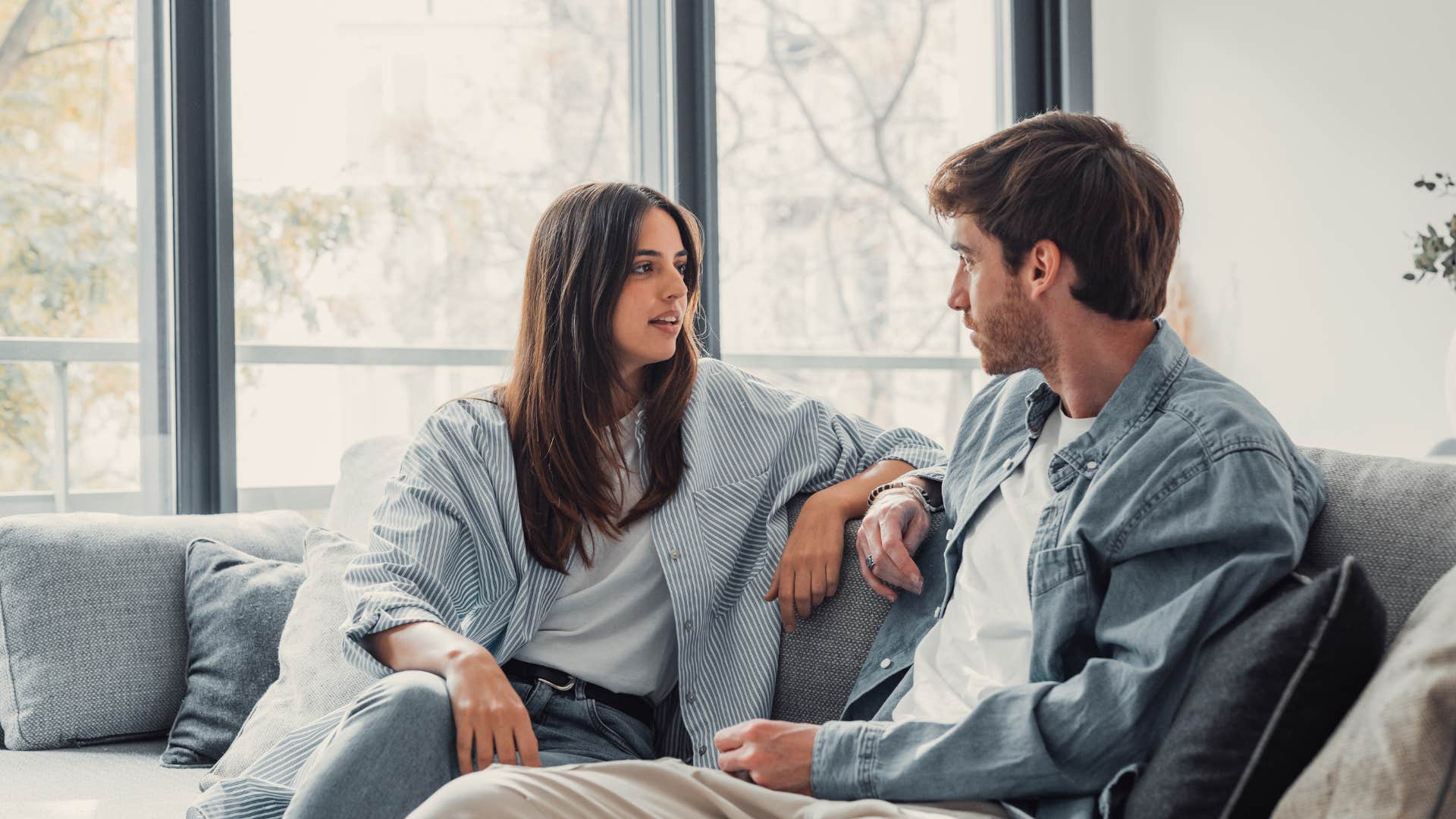 woman pretending not to notice man's little white lies