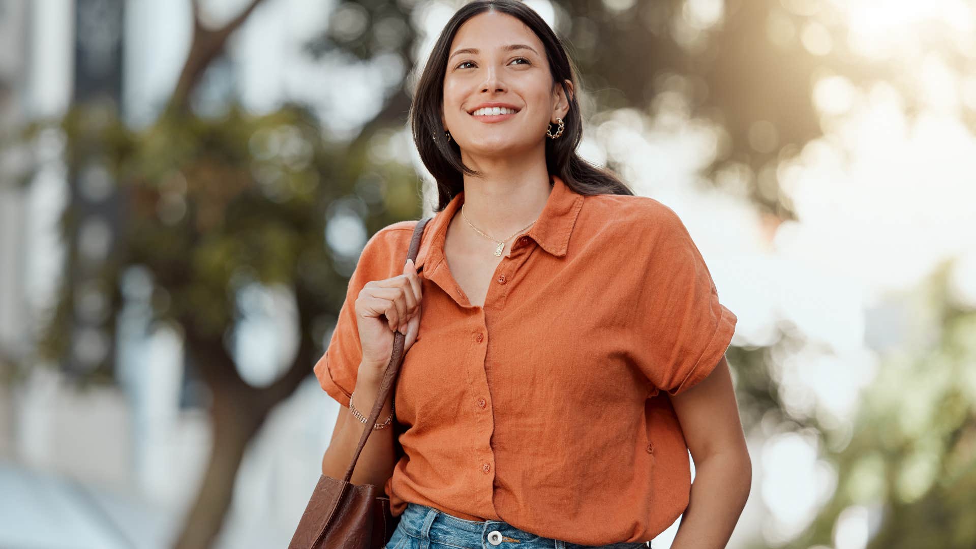 wealthy woman walking around in casual clothes outside