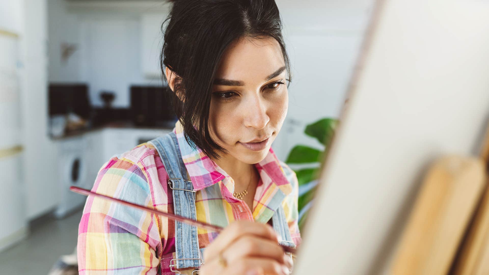 wealthy woman painting pursuing her creative passion