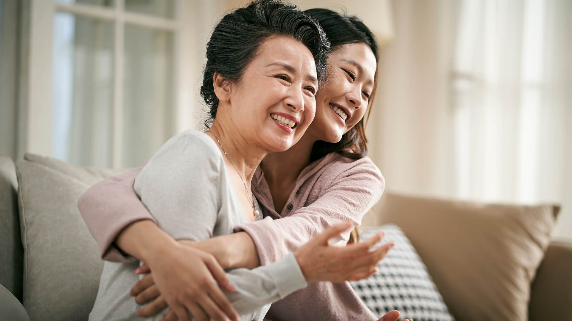 woman hugging her wealthy mom living at home