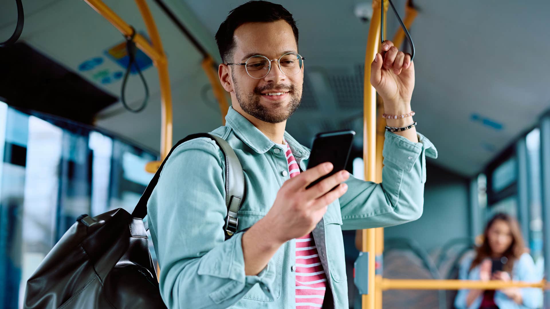 man taking public transportation instead of driving