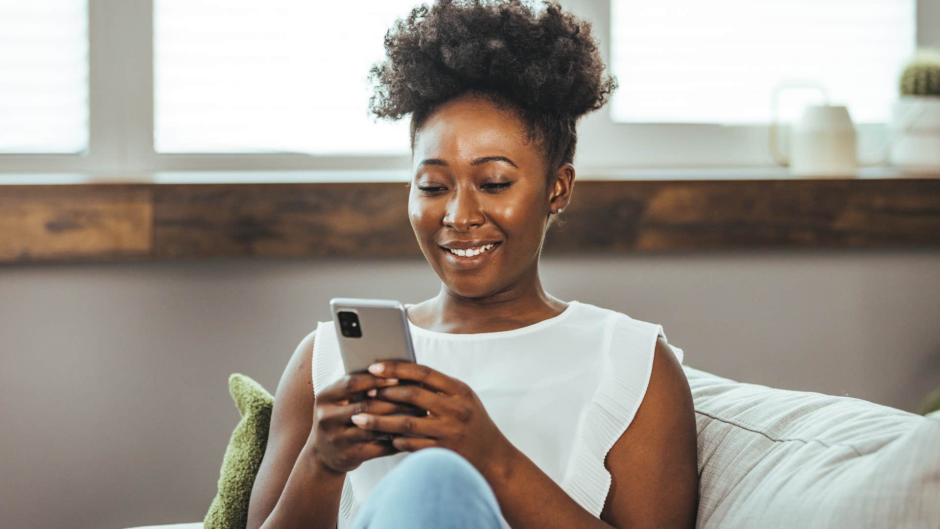 wealthy woman taking a break at home on her phone