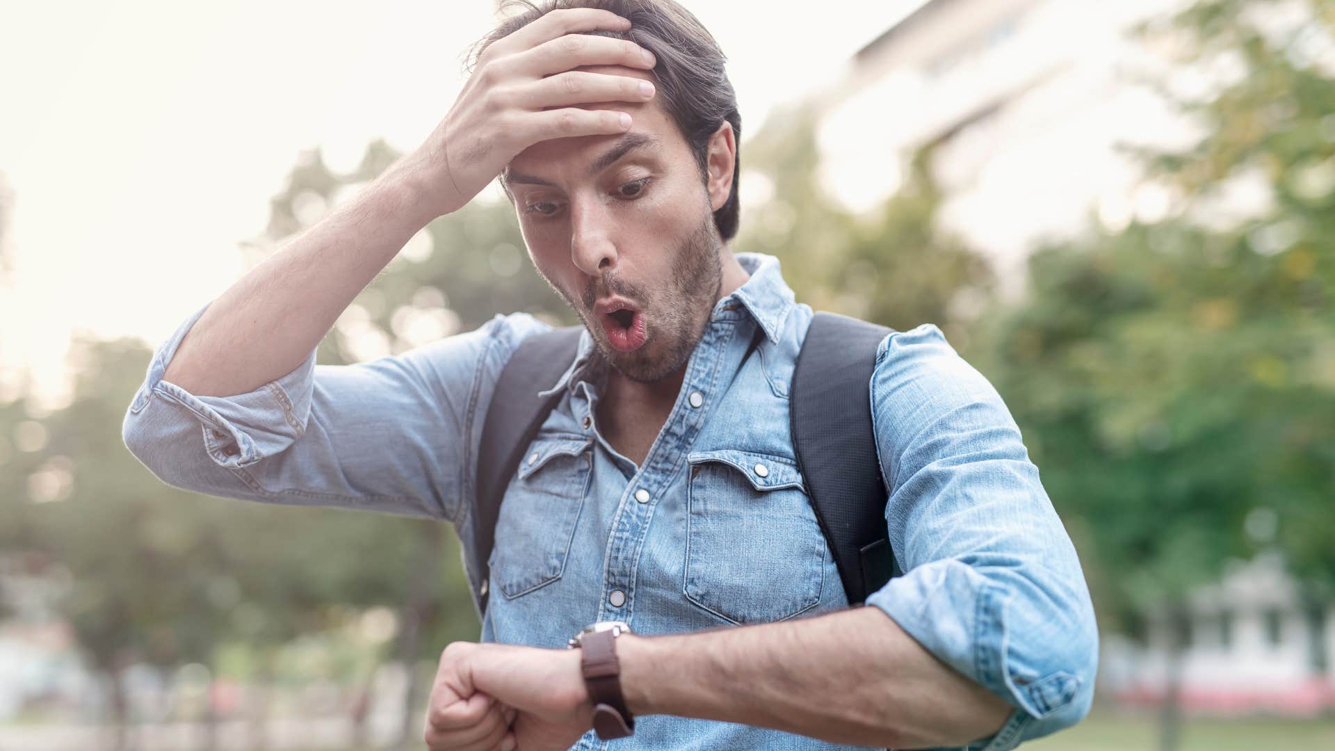 man who's always being late checking his watch