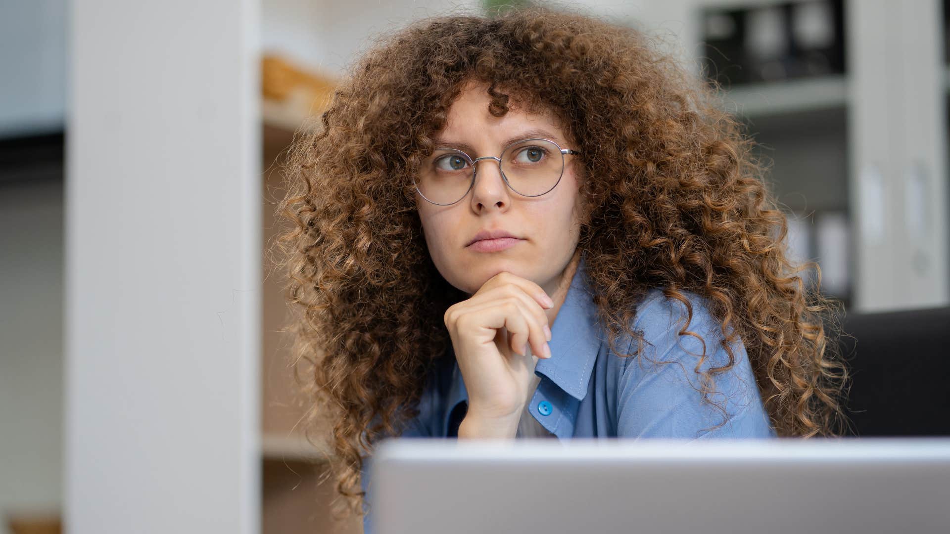 Judgemental woman looking at someone behind the camera.