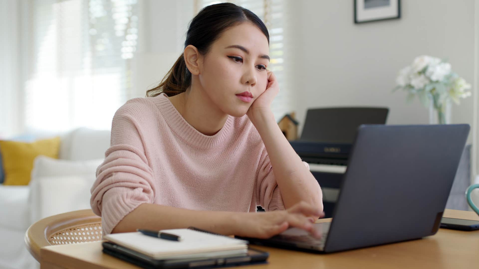 Woman who cuts corners working on her laptop.