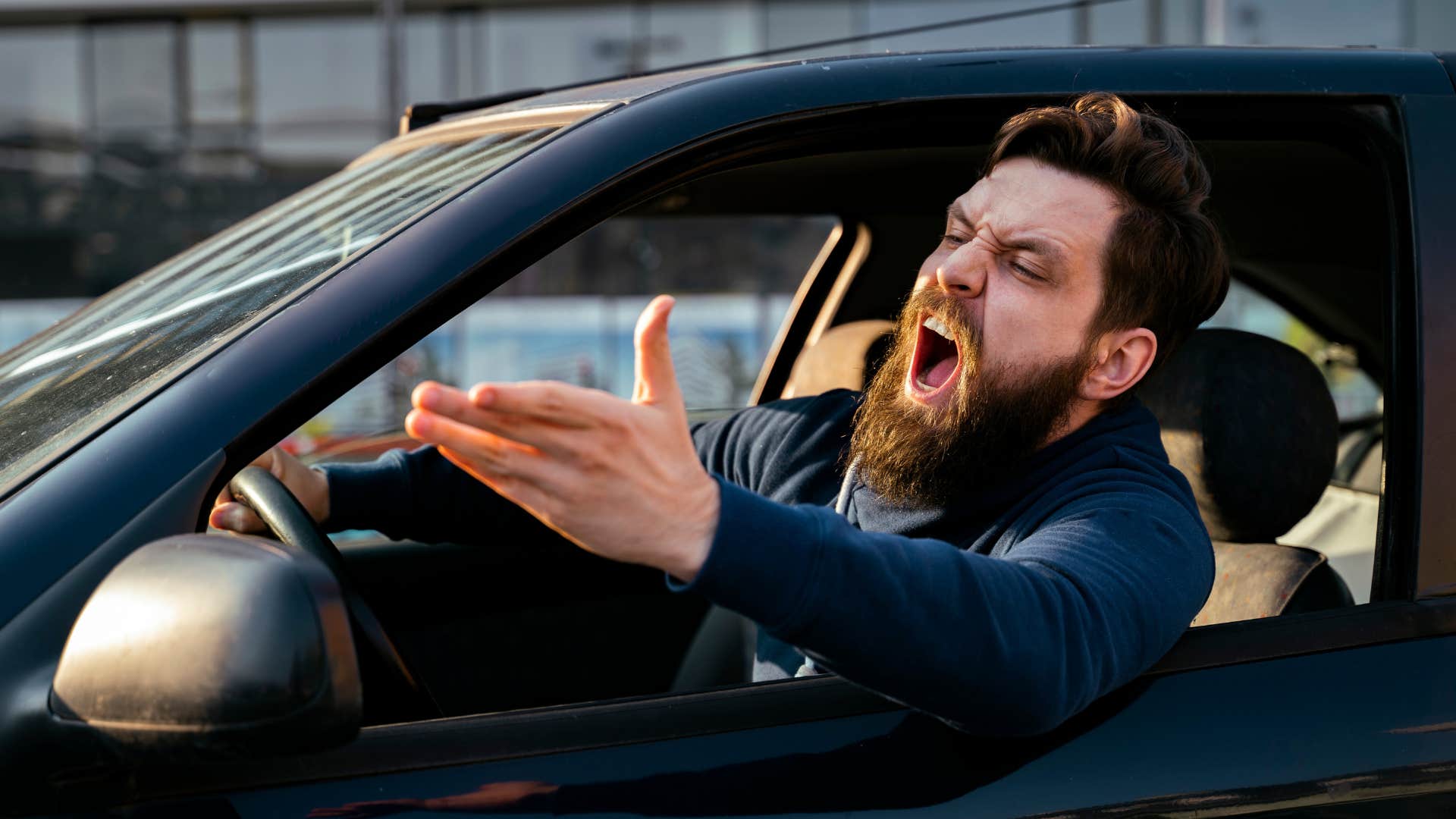 a burned out man has an emotional outbursts while driving