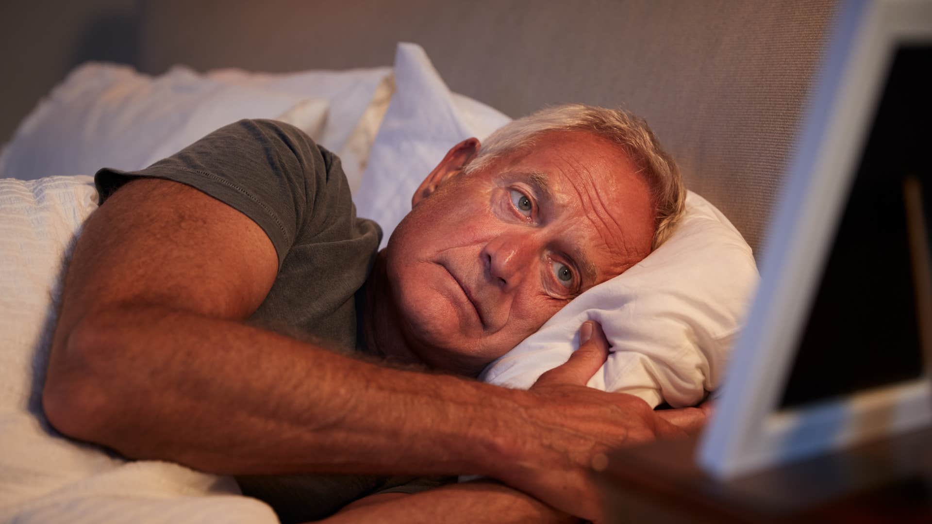 an older man has sleep disturbances due to burnout