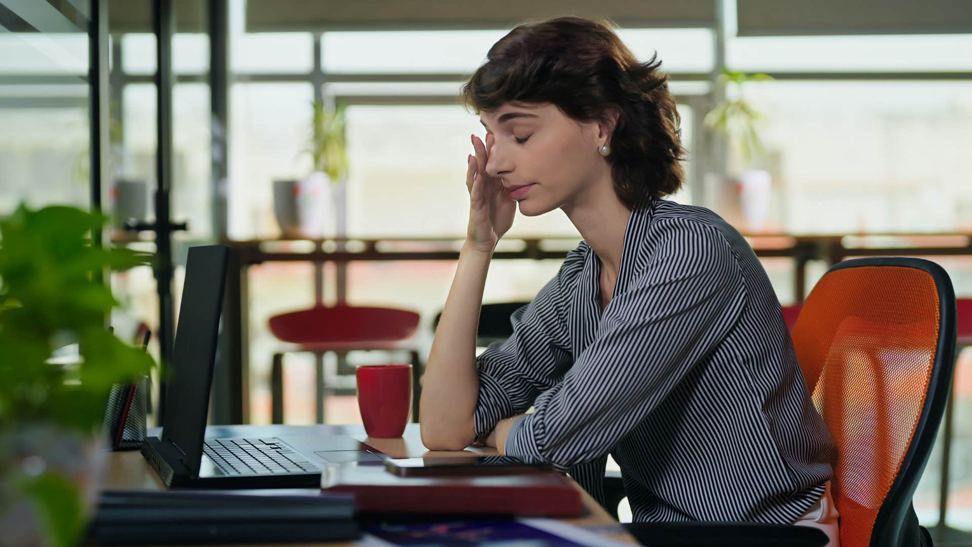 a gen z woman is burnout from overworking at her job