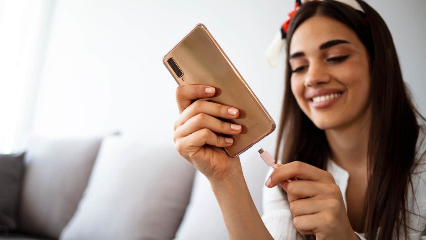 woman charging her phone
