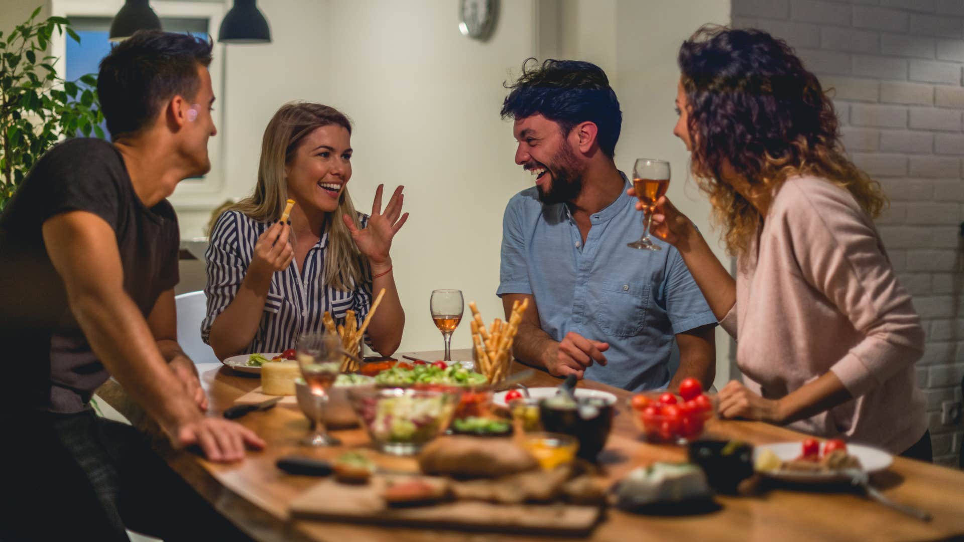 group of friends eating at their dining table
