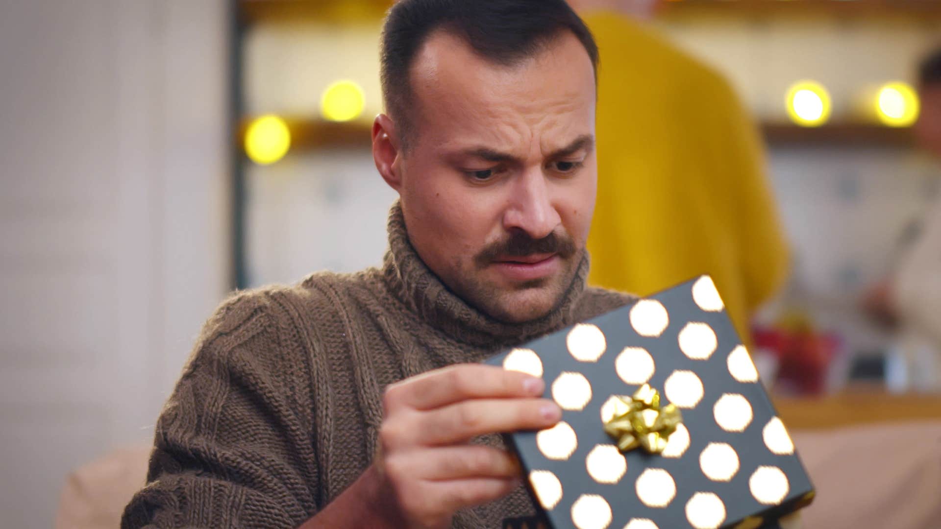a man sees his wealthy friend got him a watch that is better than his own at home