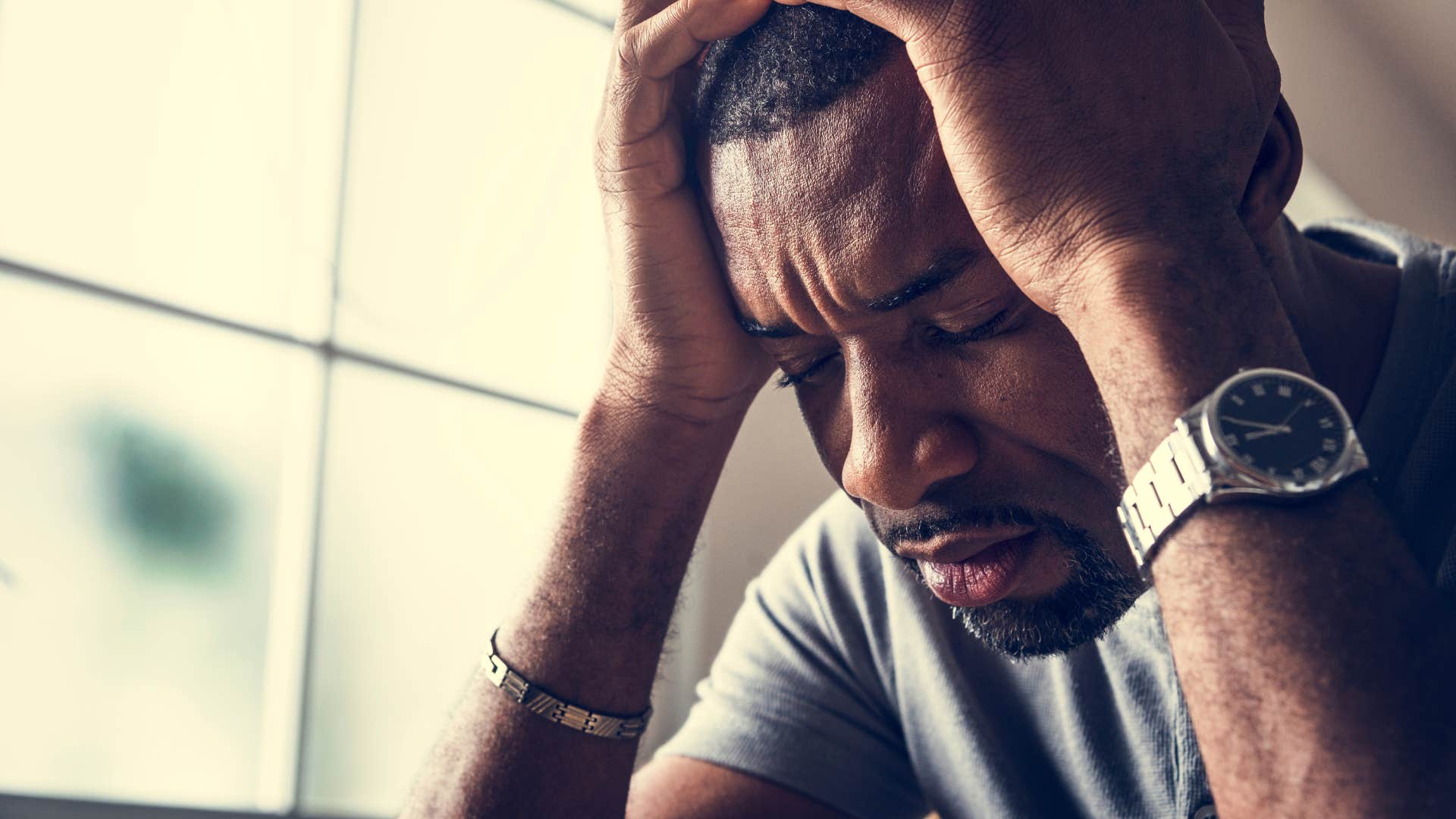 sad man embracing the need to cry