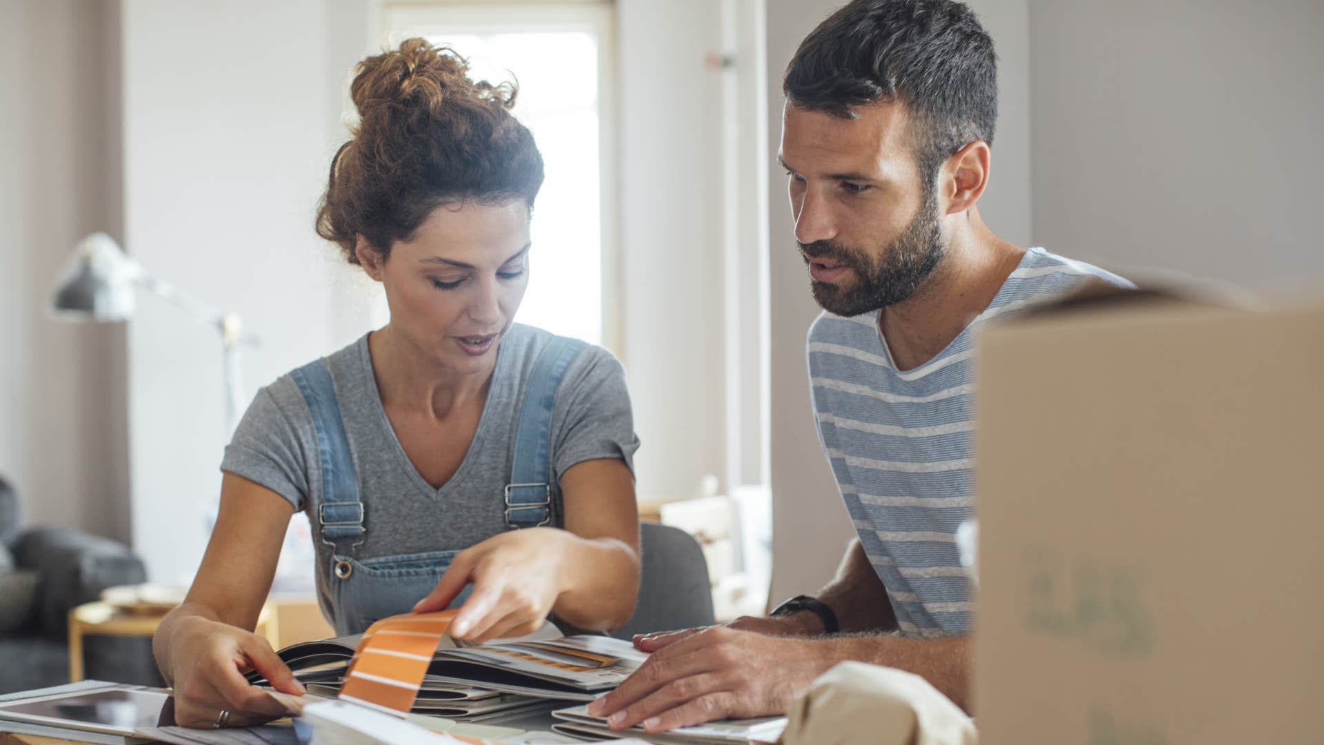 couple tallying cost of home renovations