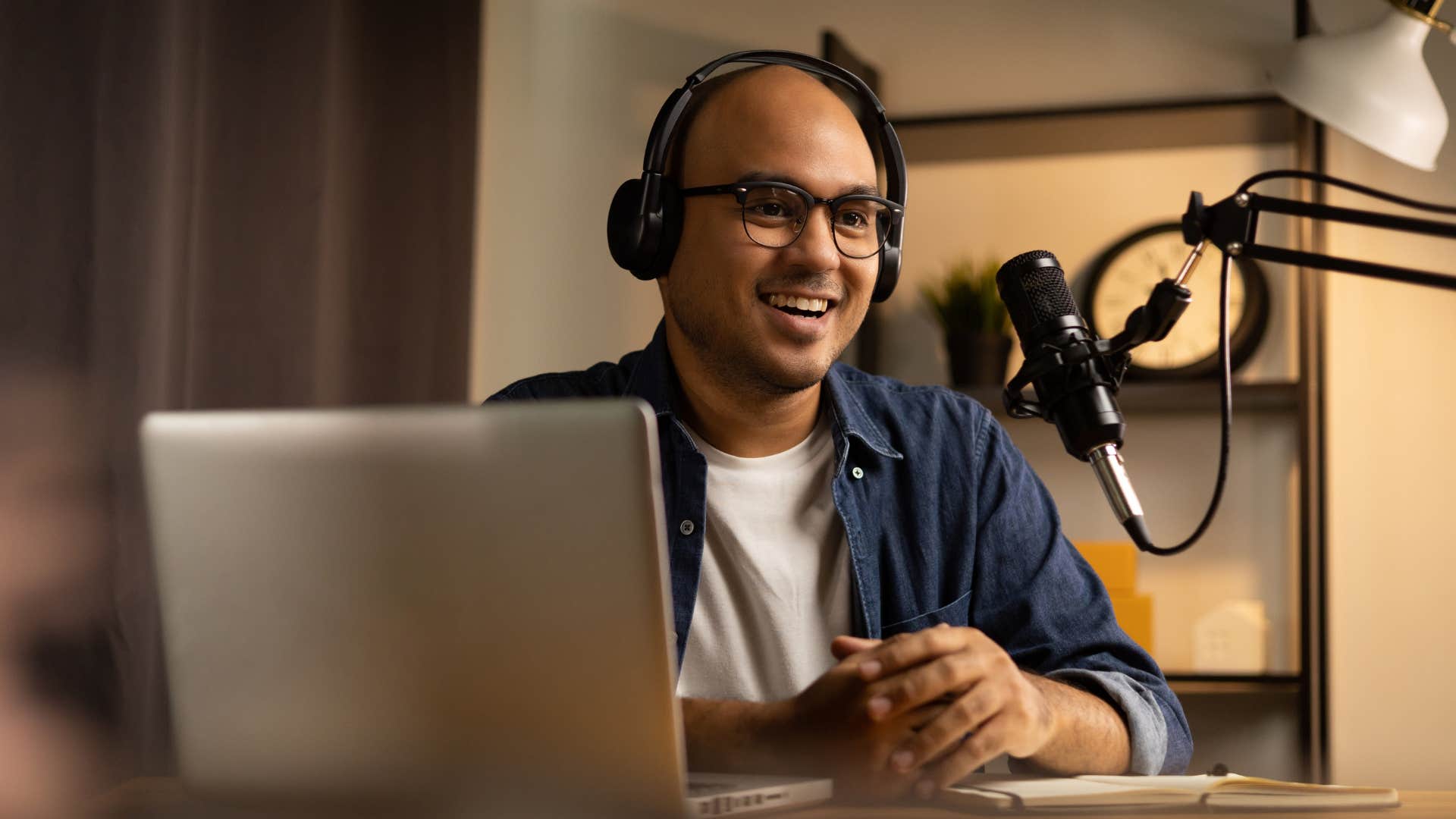 annoying man talking into a podcast microphone