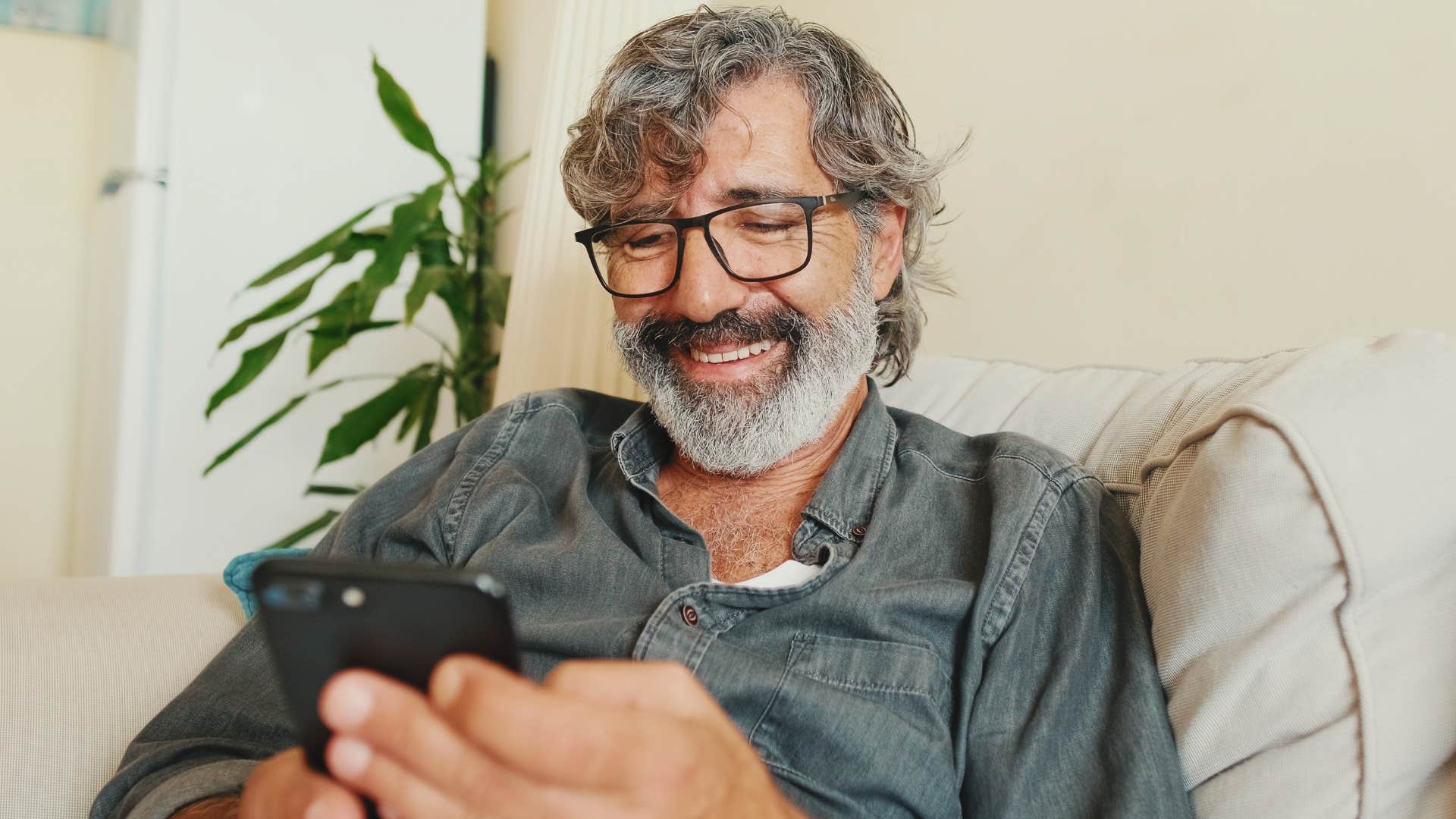 man on phone curating an aesthetic in every aspect of his life
