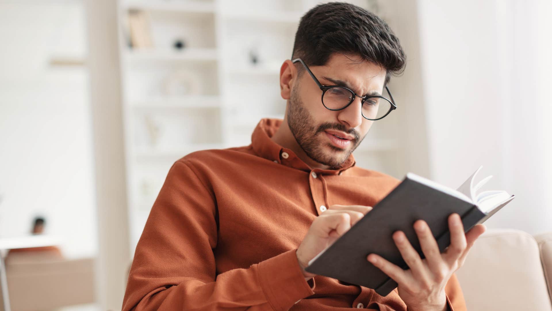 a sentimental man reads his old journal