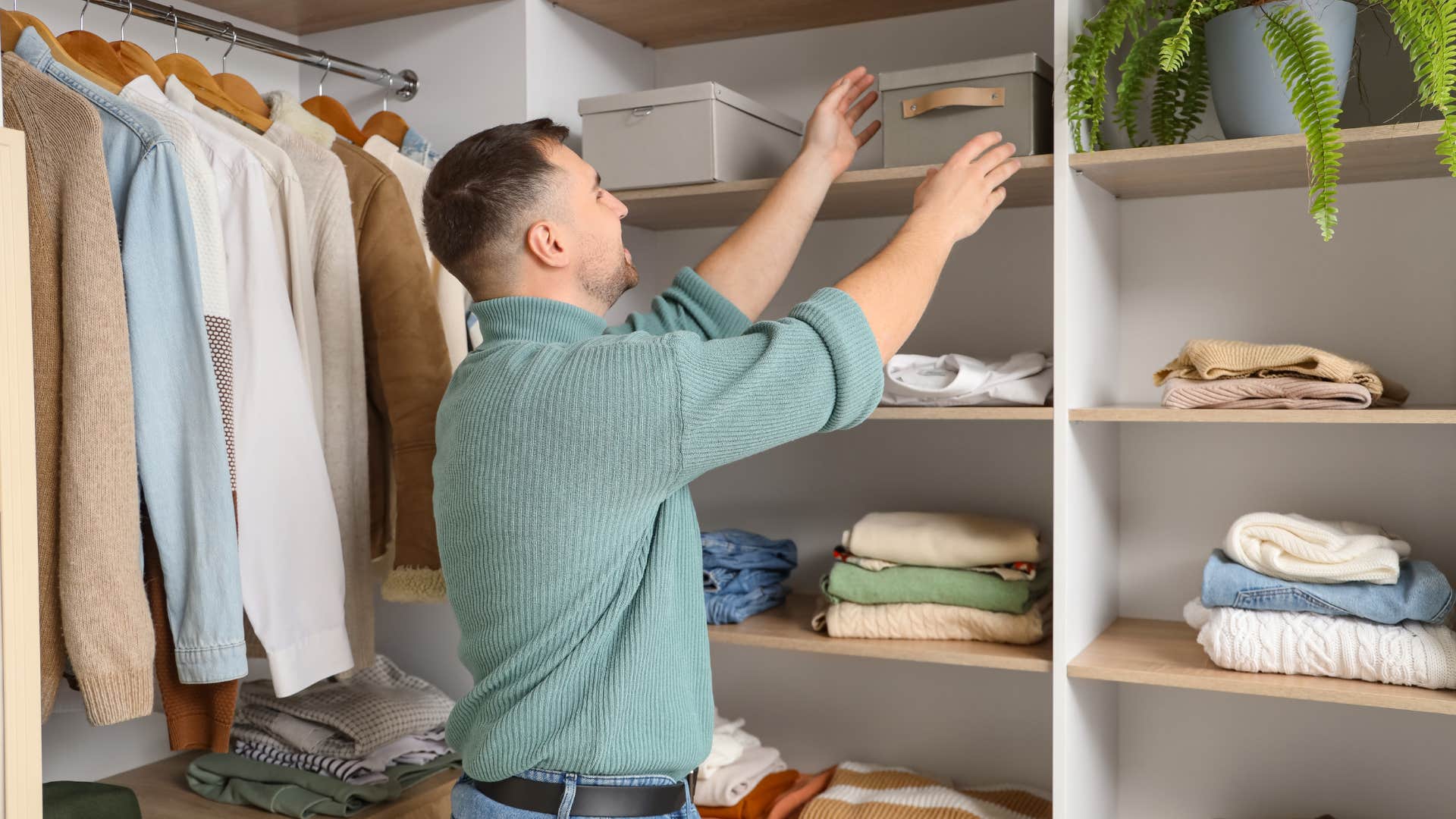 upper middle class man in his walk-in closet