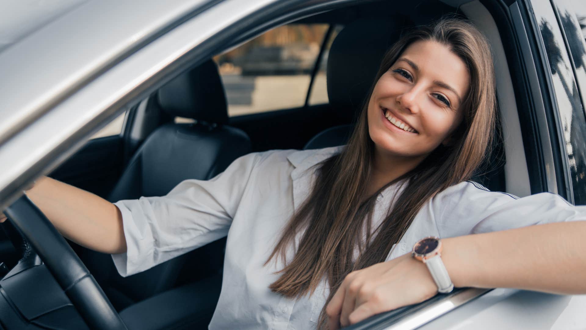 woman driving a luxury car