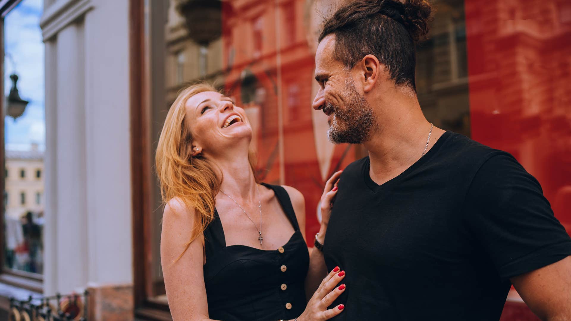 woman with natural attraction skills inviting man into personal space