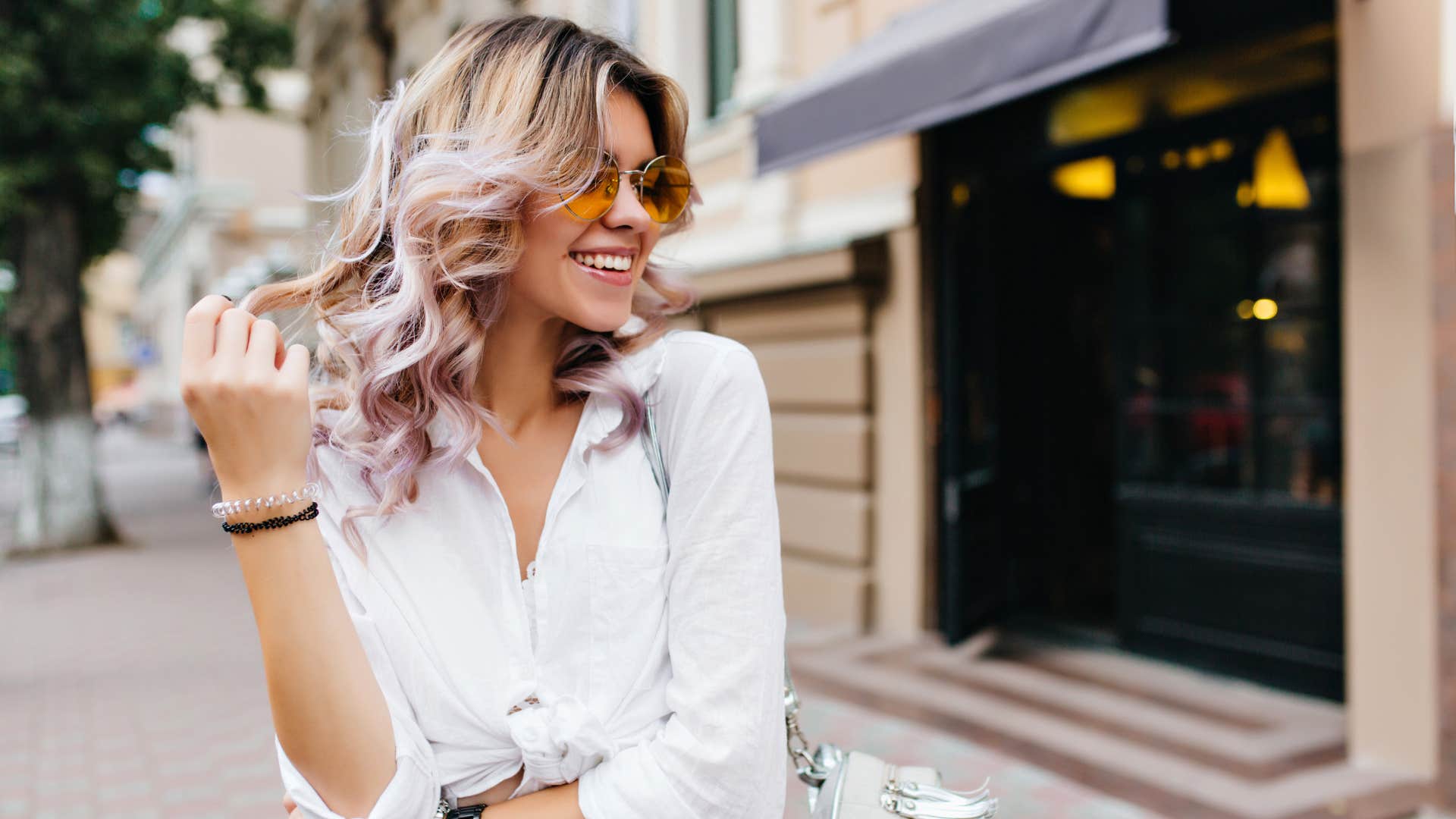 woman with natural attraction skills playing with hair