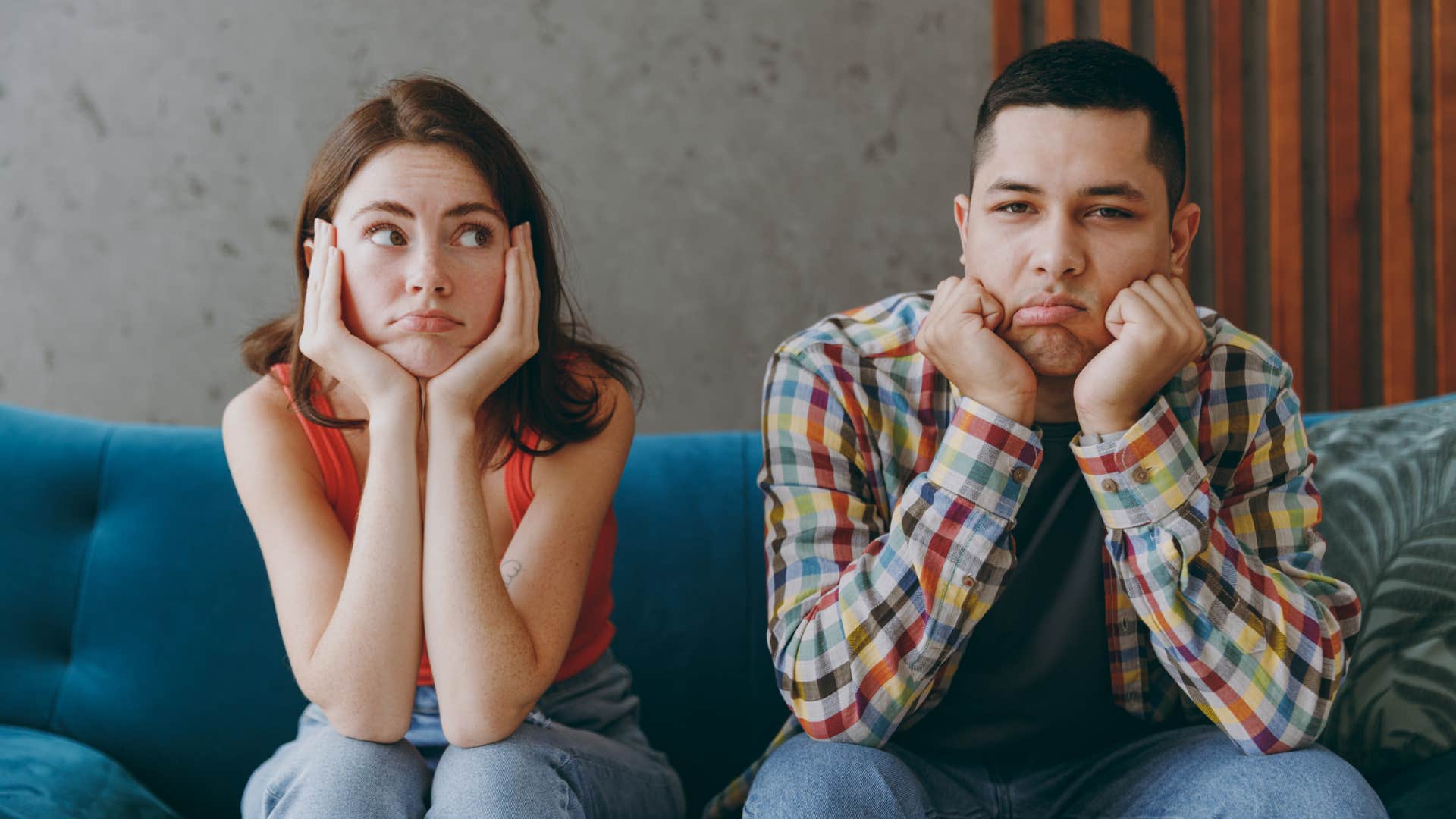 couple sitting next to each other bored