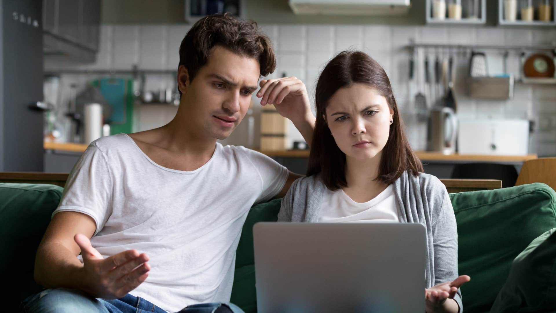 couple looking at social media comparing their relationship to others