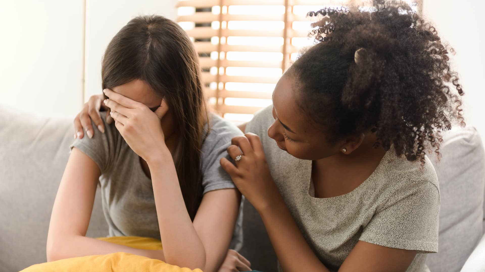a woman comforts her married friend after noticing how quiet she is