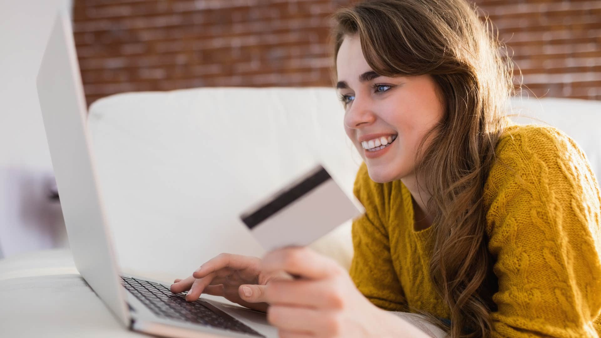 Woman saying "I'll figure it out next month" while buying something online.