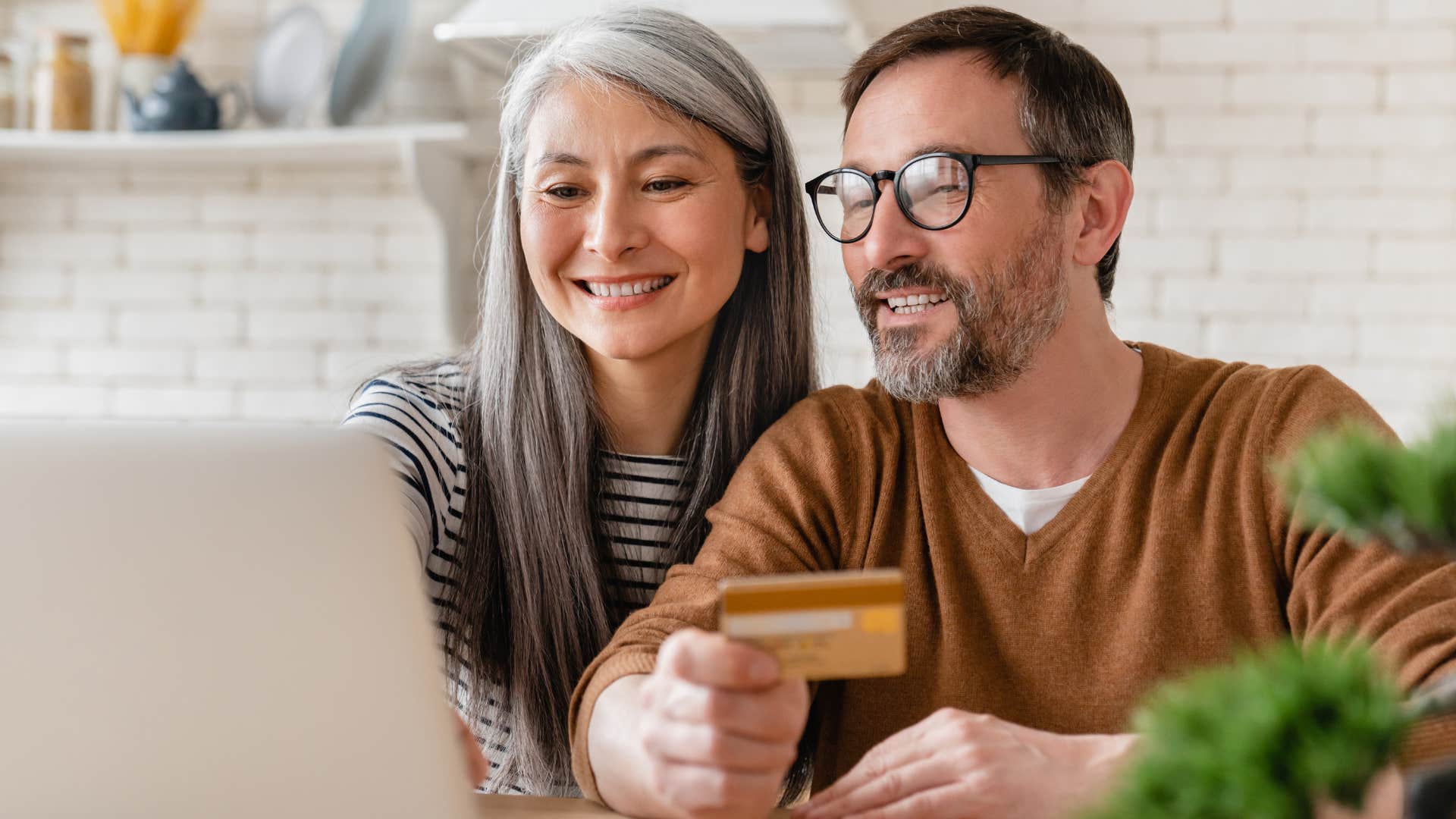 Man saying "I'll just return it" while buying things online with his wife.