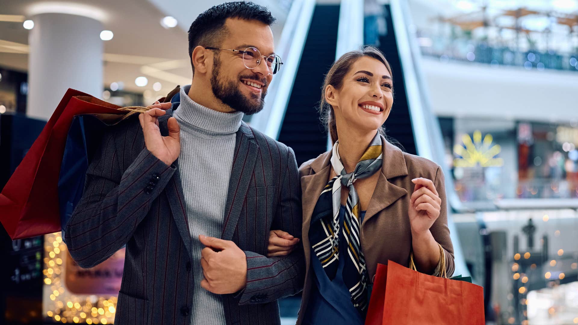 Man saying "it's just retail therapy" while shopping with his partner.
