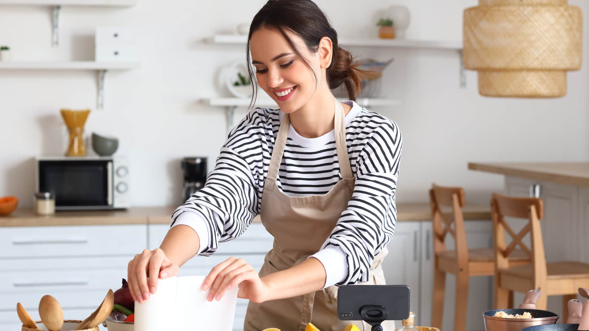 woman using single-use products in her kitchen